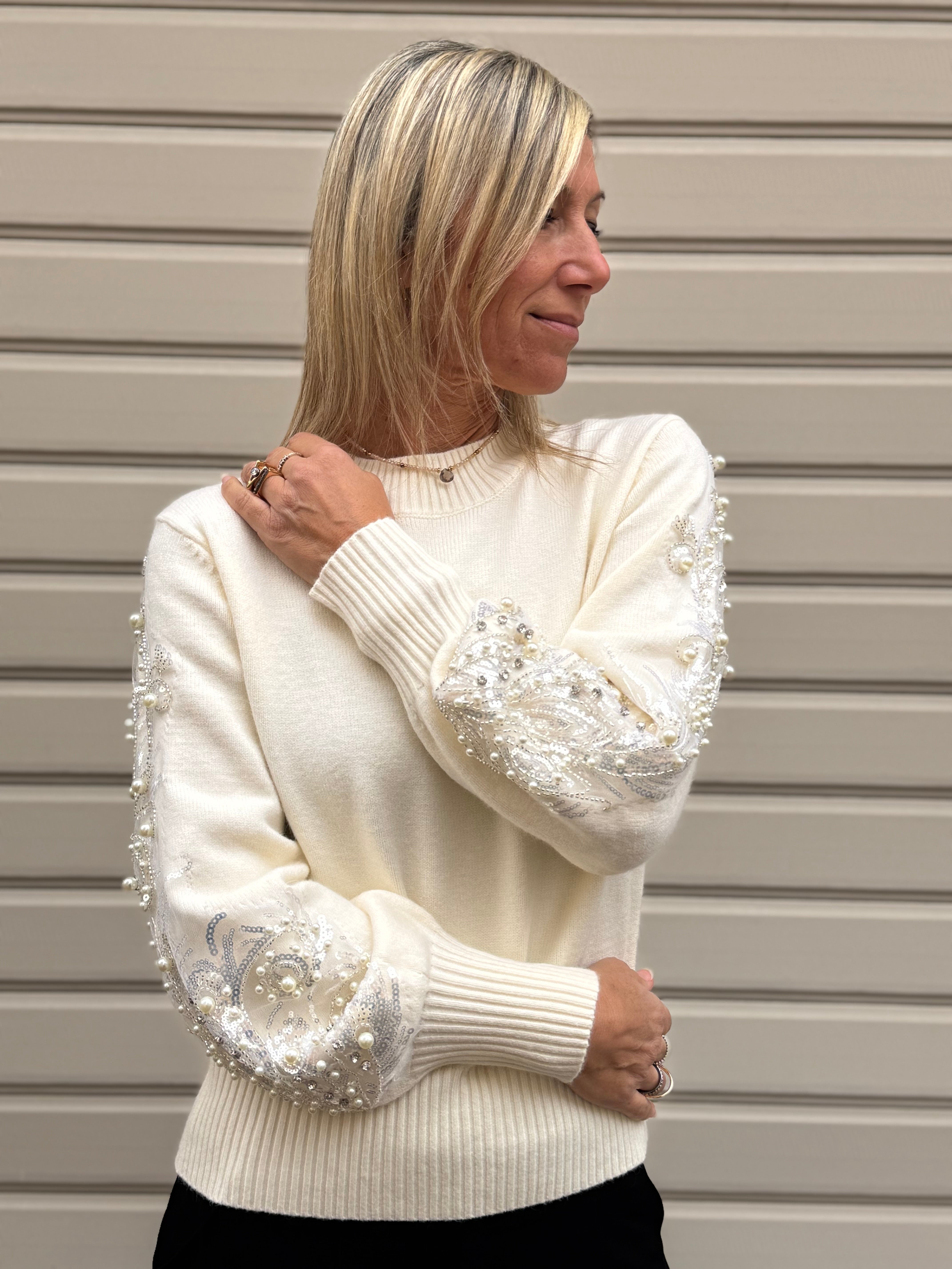 Girocollo maniche perle artigli