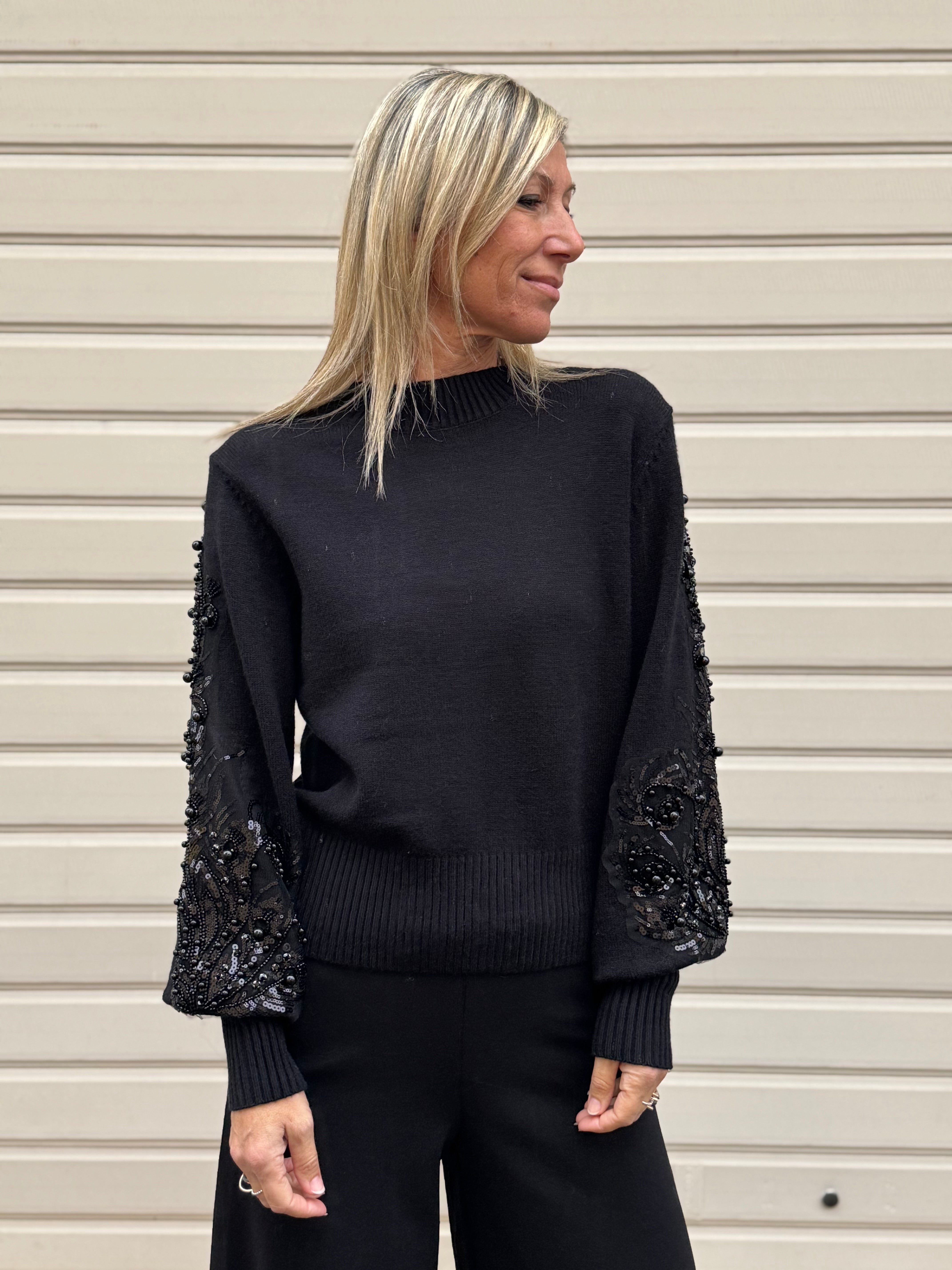 Girocollo maniche perle artigli