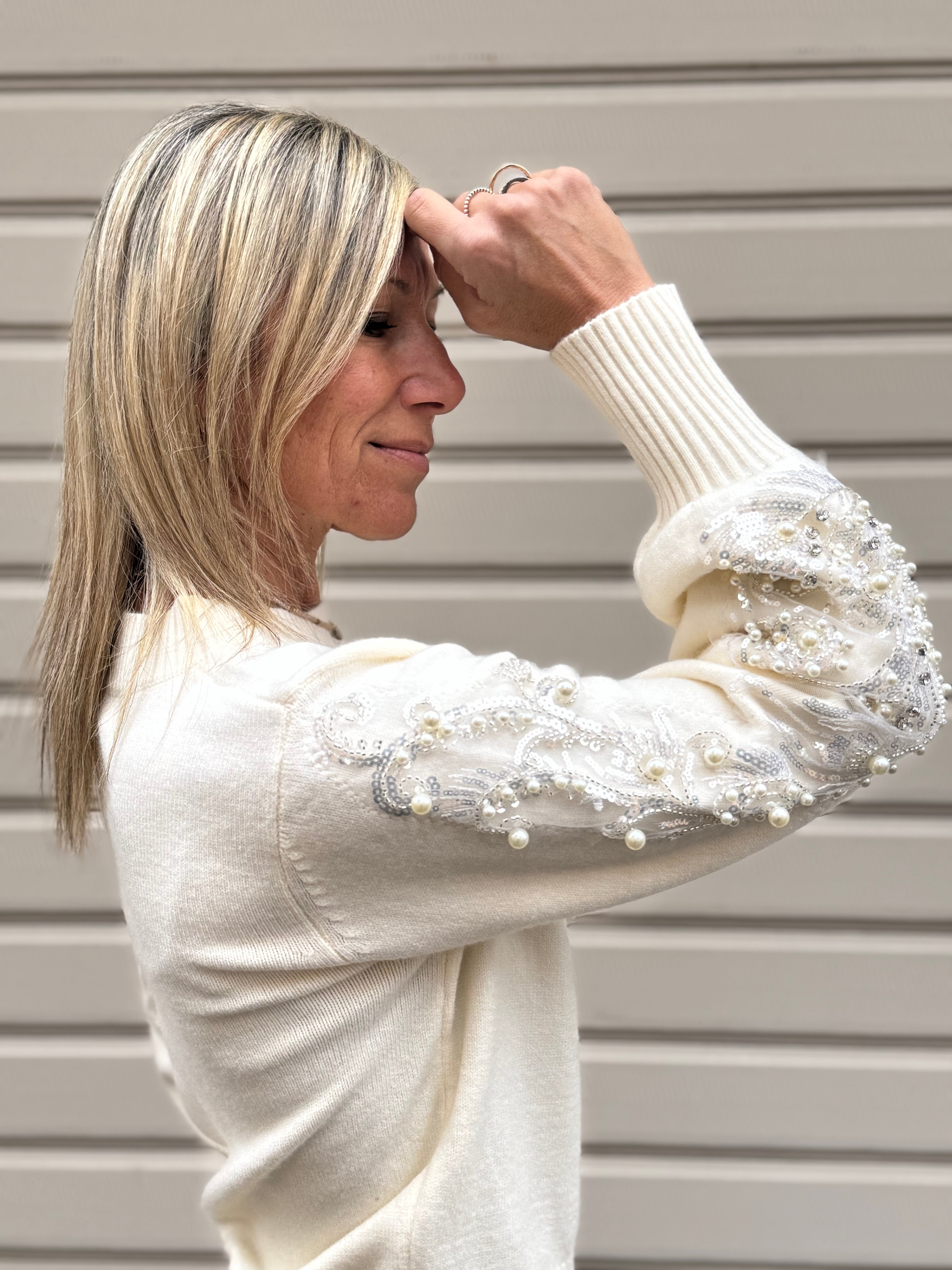 Girocollo maniche perle artigli