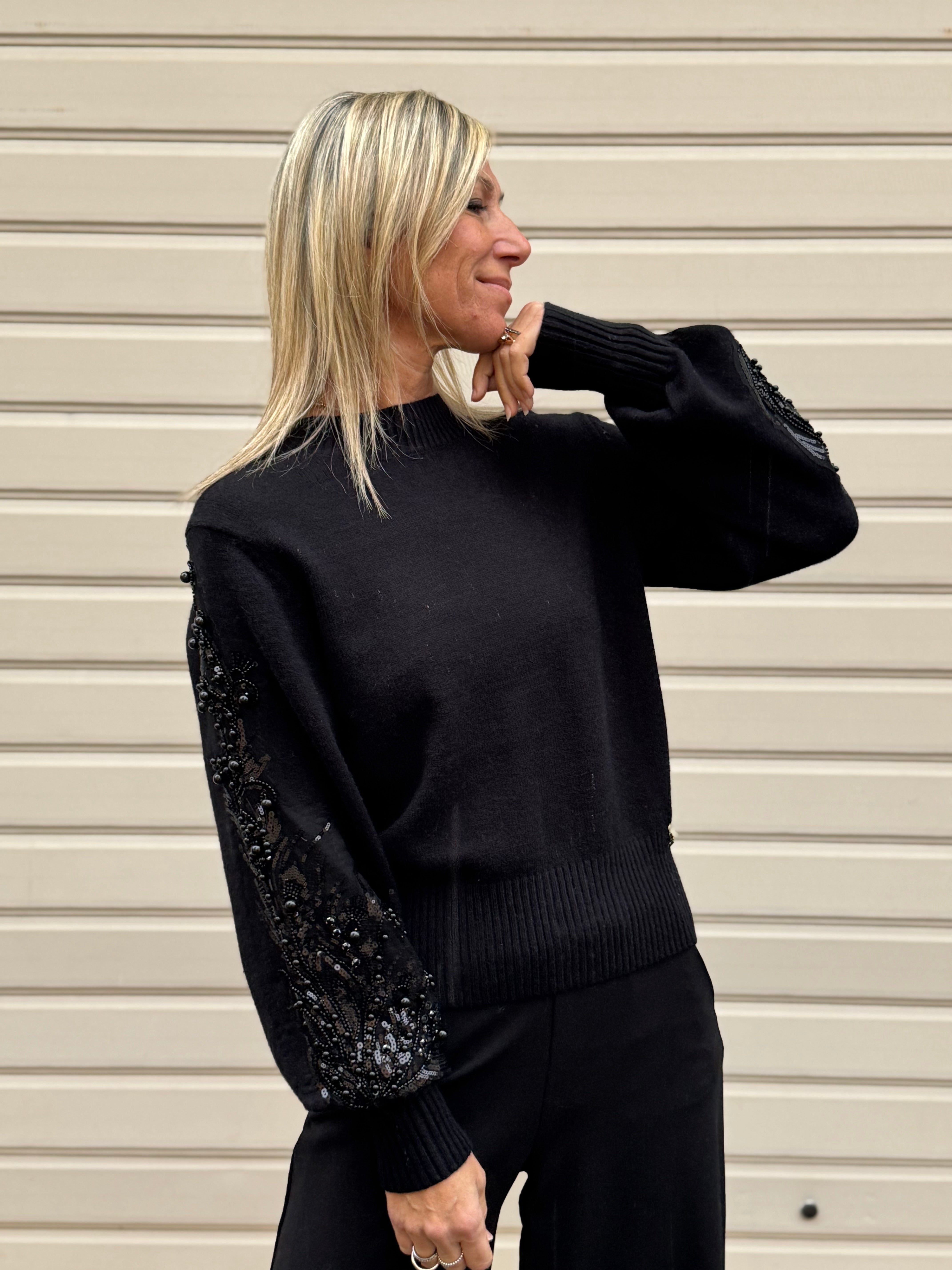 Girocollo maniche perle artigli