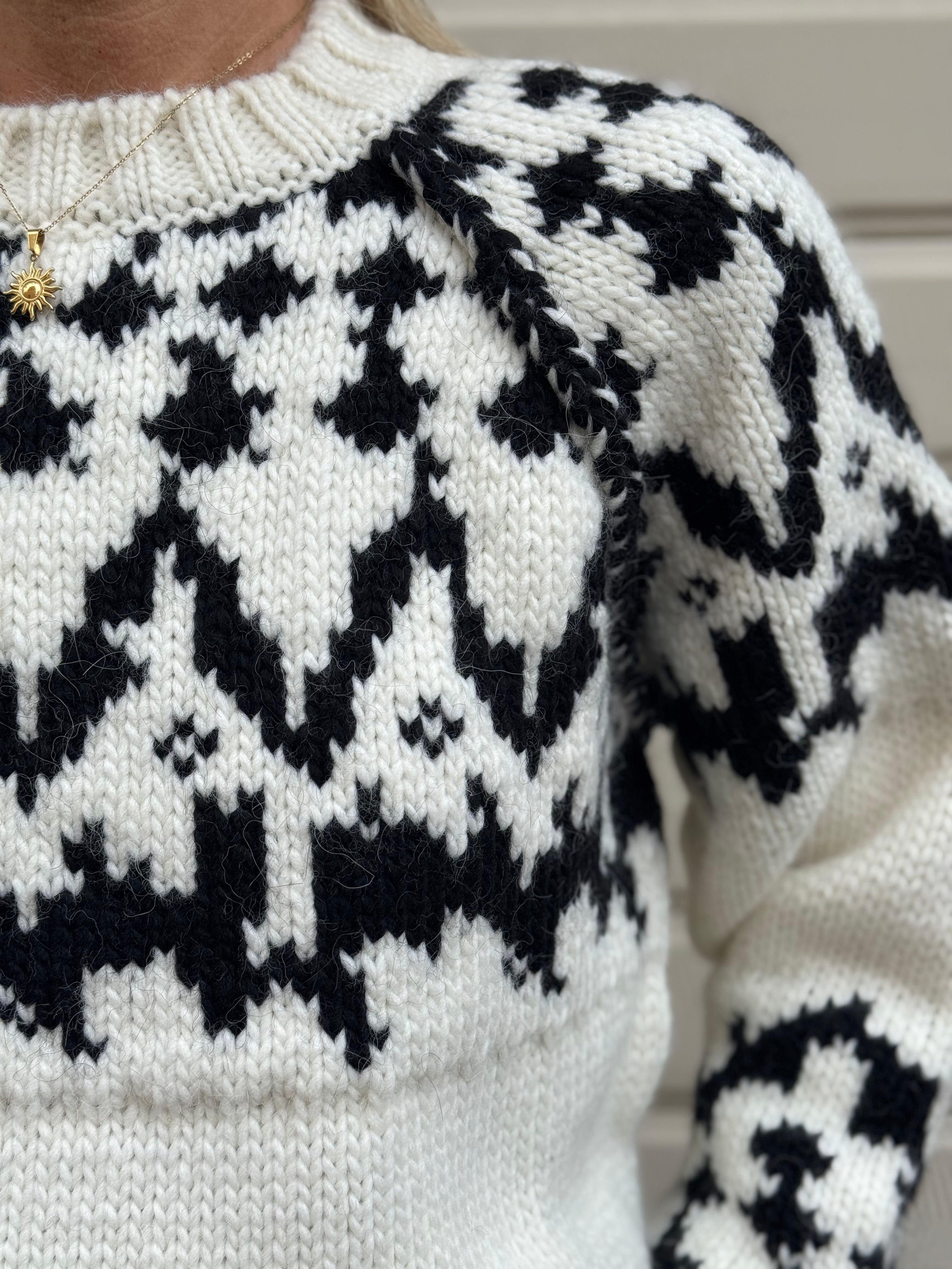 Maglione fiocco kontatto