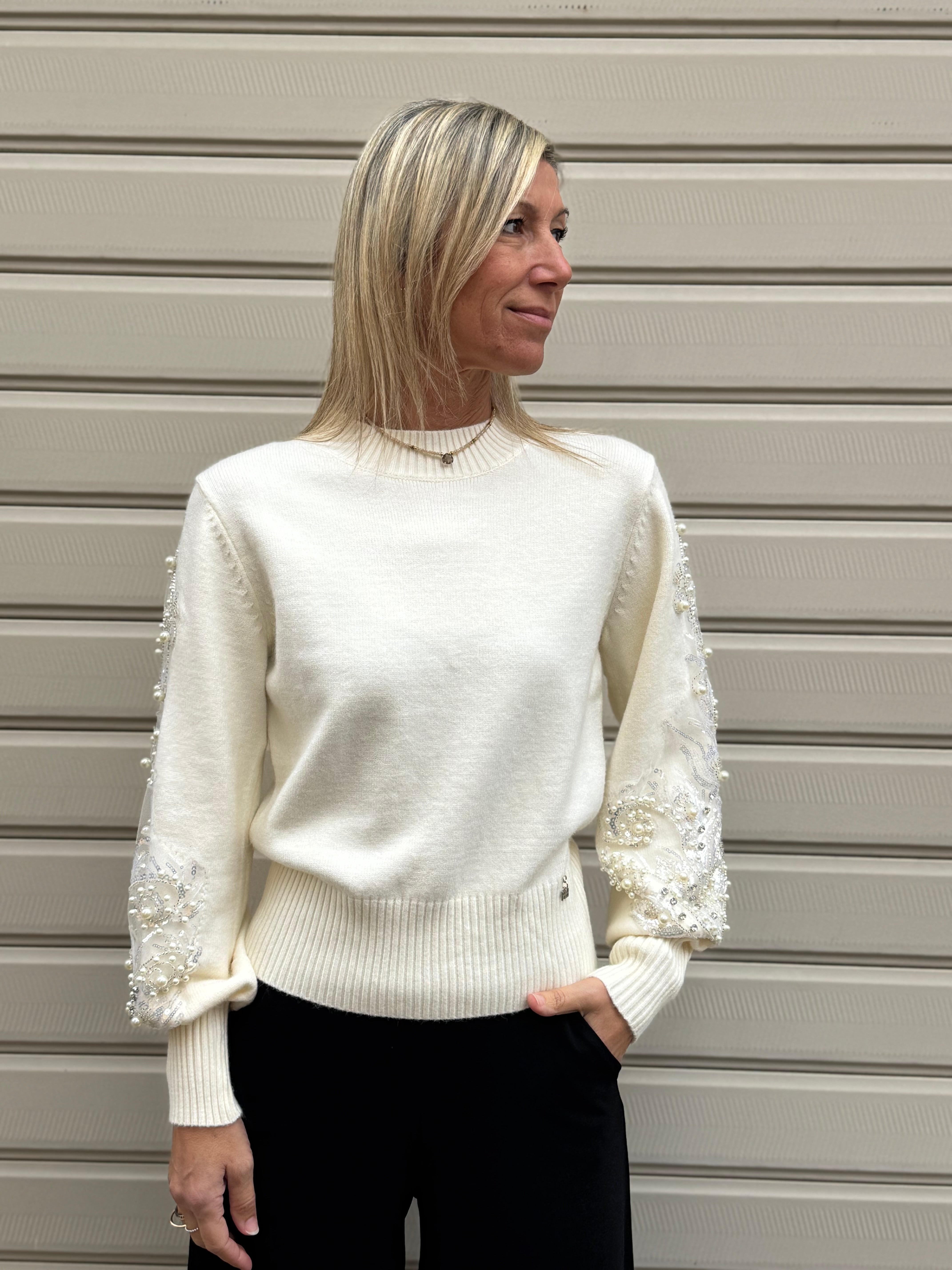 Girocollo maniche perle artigli