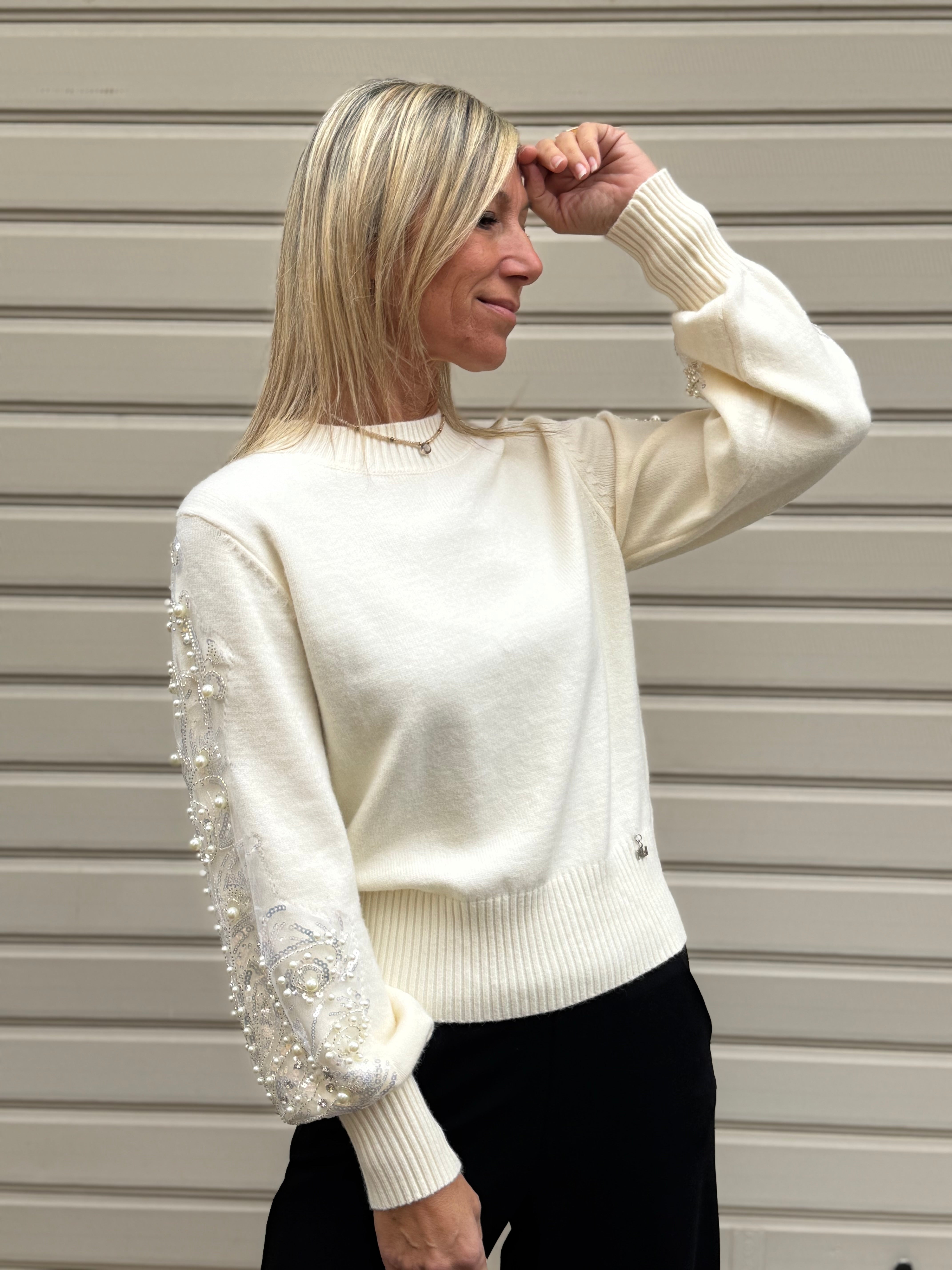 Girocollo maniche perle artigli