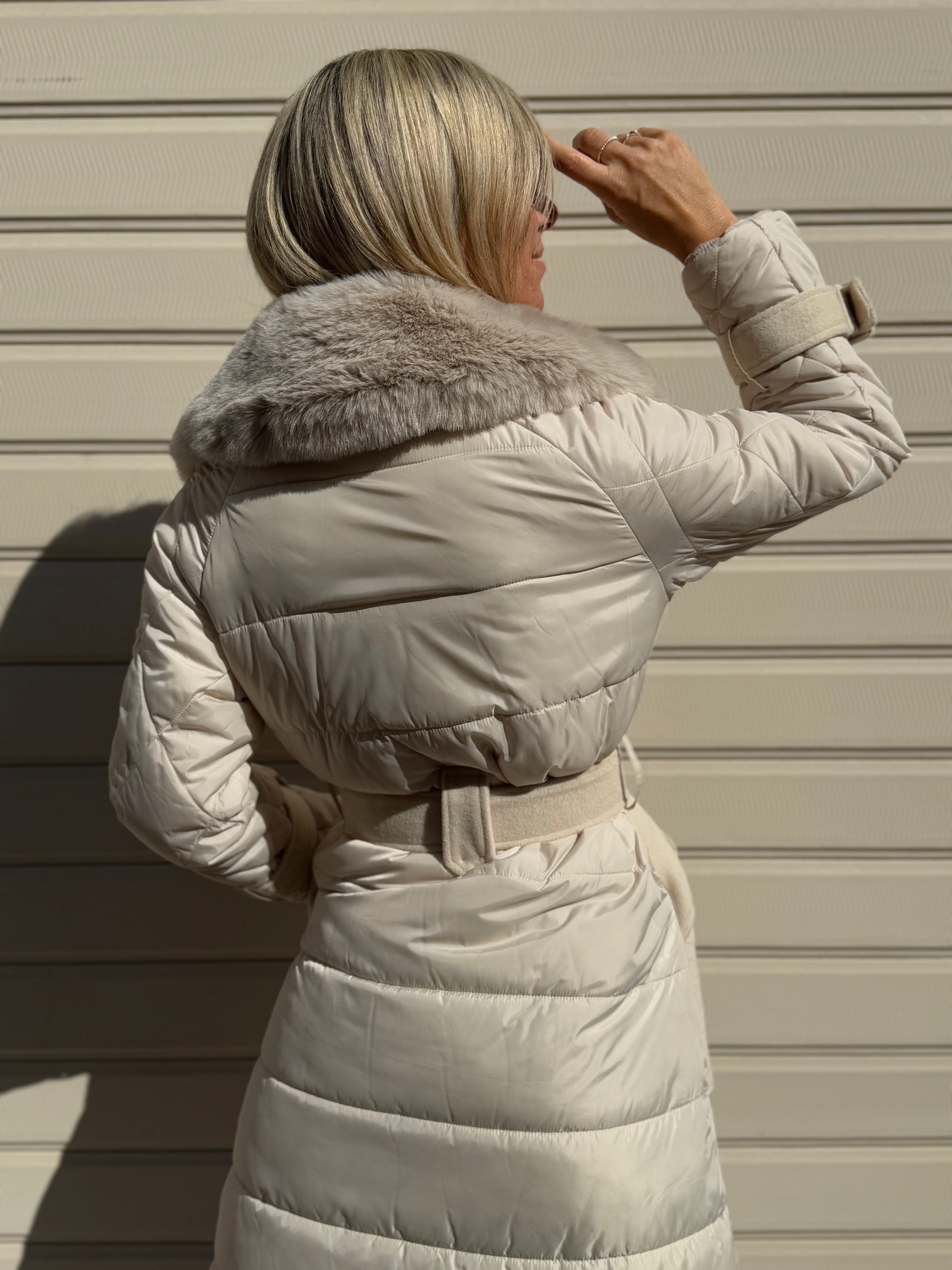 Cappotto piumino artigli