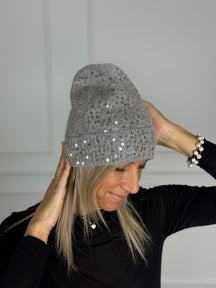 Cuffia paillettes artigli