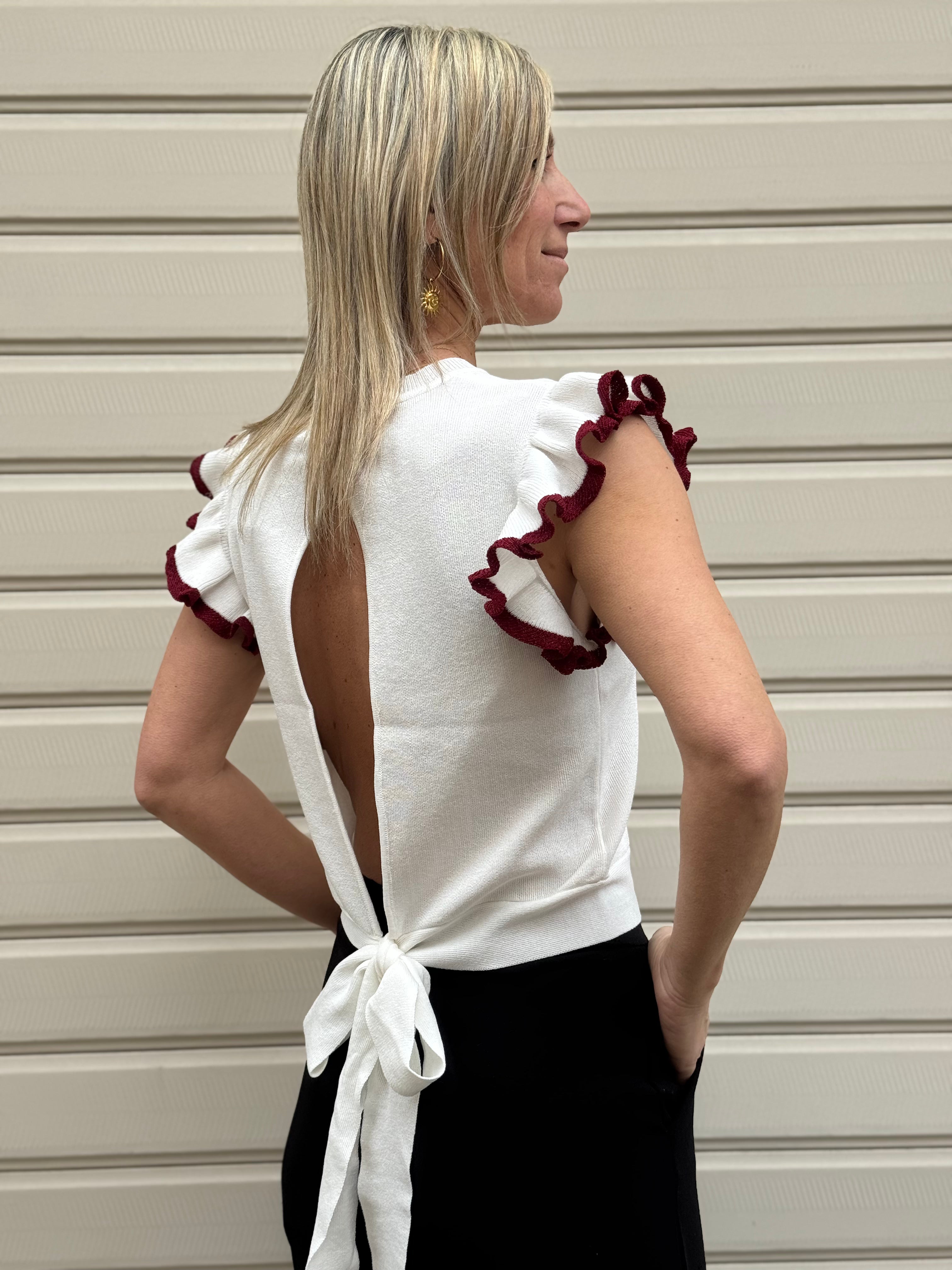 Maglia apertura schiena artigli