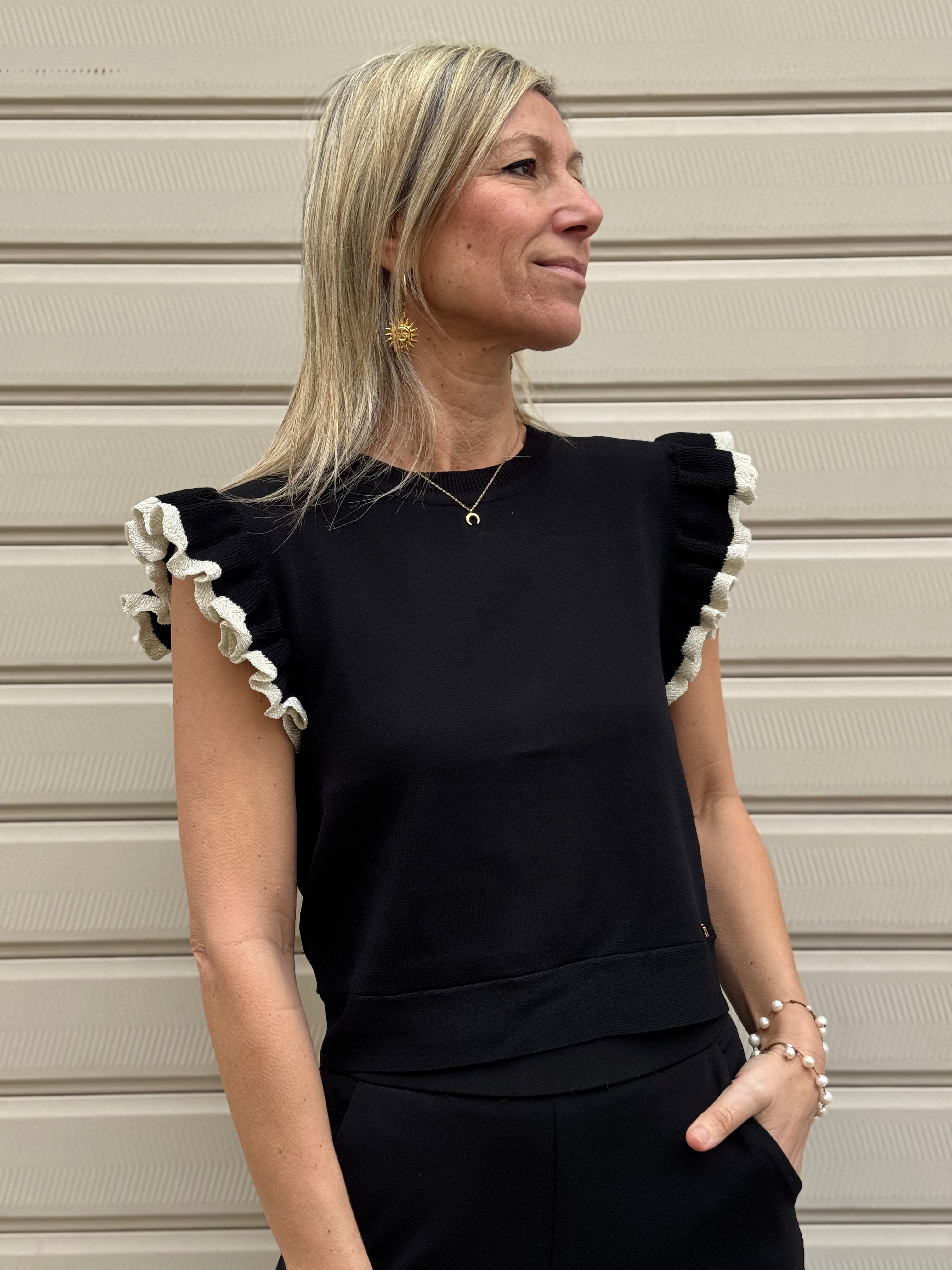 Maglia apertura schiena artigli