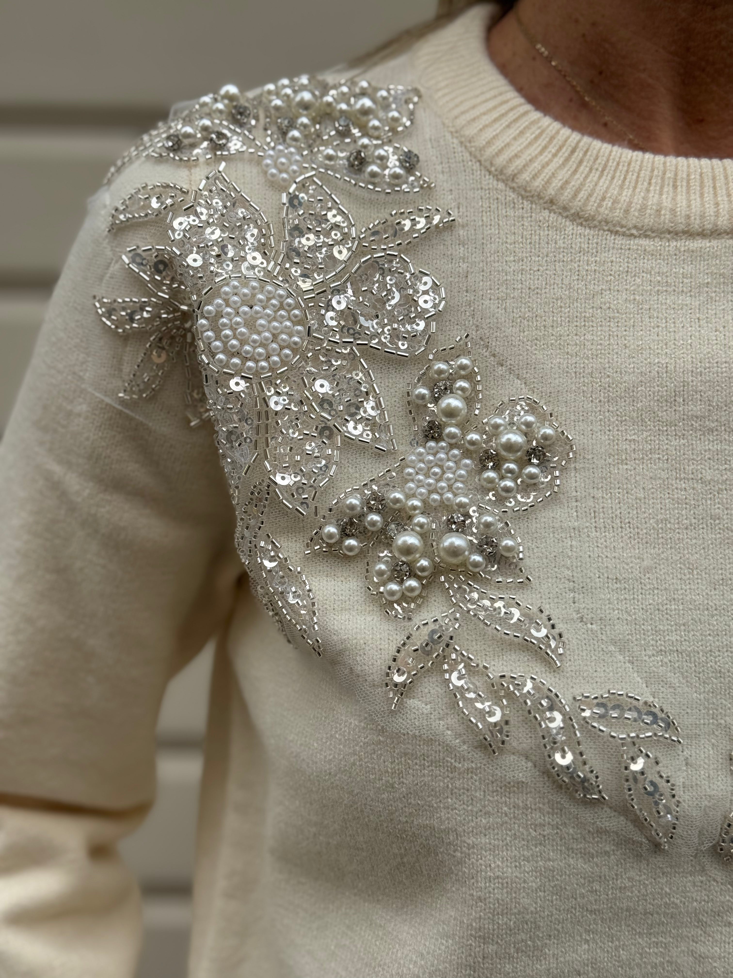 Maglia girocollo perle artigli